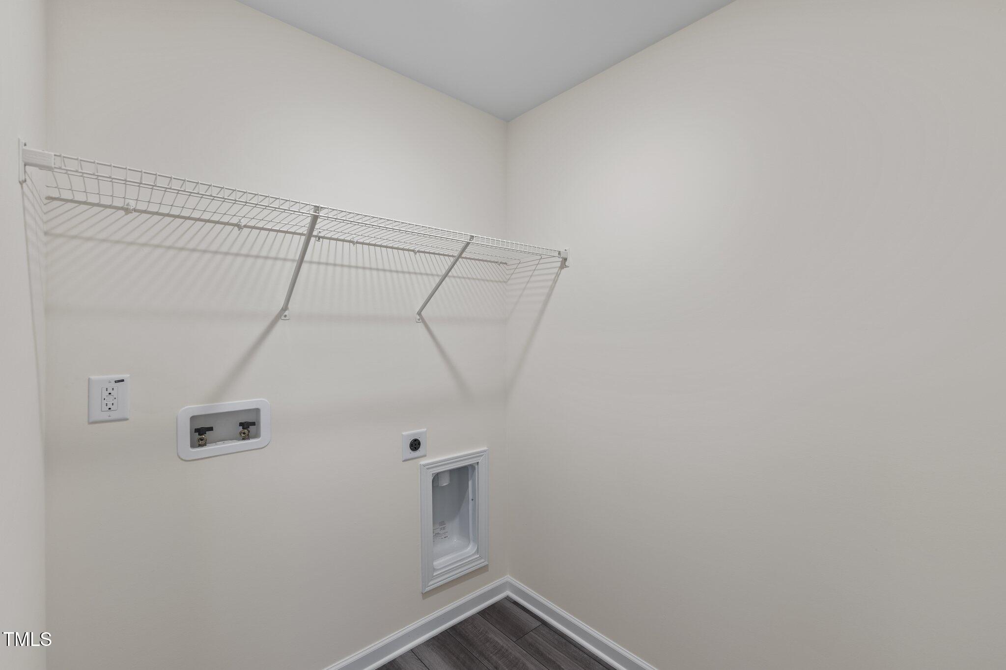 109 Gladstone Loop Clayton, NC 27520 - Photo 15 of 21 a view of a room with racks on the wall