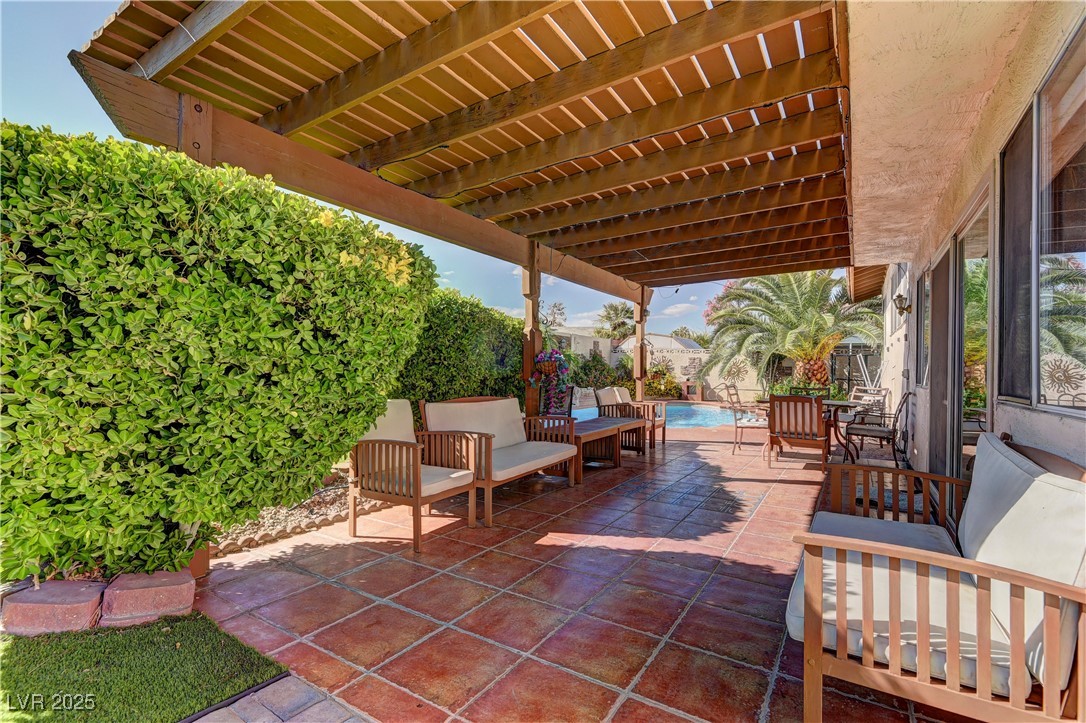 3751 El Camino Road Las Vegas, NV 89103 - Photo 25 of 27 View of patio with an outdoor pool and an outdoor living space