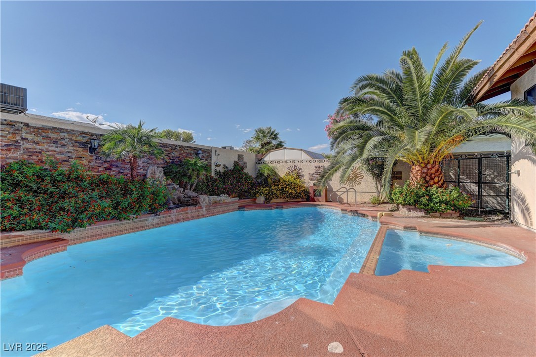3751 El Camino Road Las Vegas, NV 89103 - Photo 26 of 27 View of pool with a fenced backyard, an in-ground hot tub, and a patio area