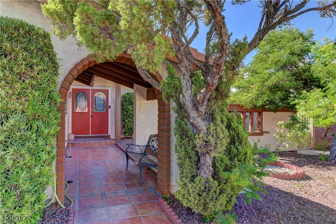 3751 El Camino Road Las Vegas, NV 89103 - Photo 4 of 27 Doorway to property with stucco siding