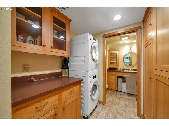 a kitchen with a refrigerator and cabinets