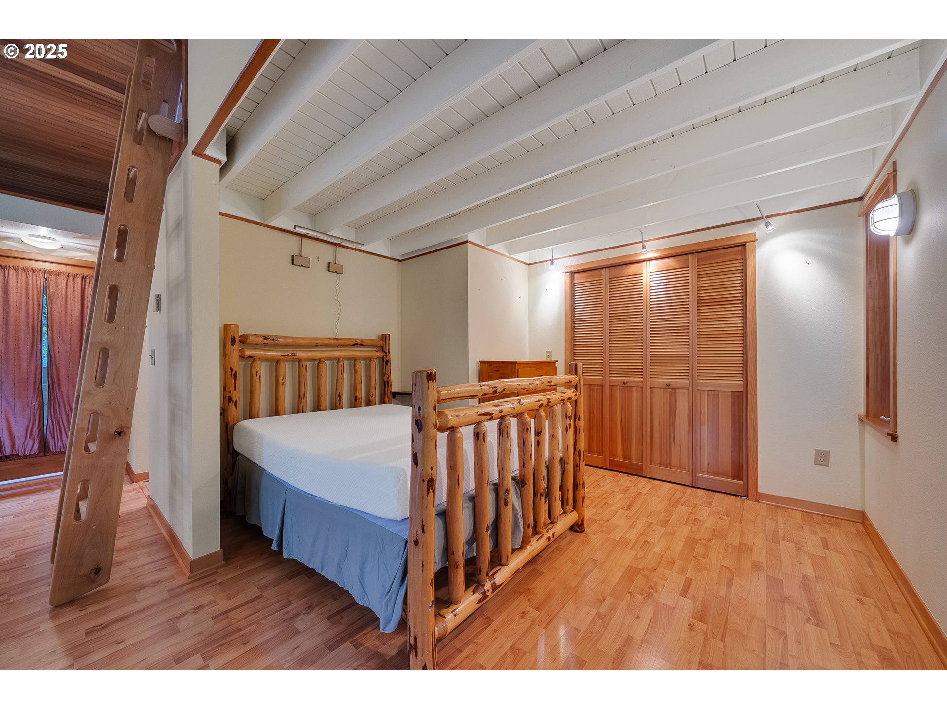 24760 Trask West Tillamook, OR 97141 - Photo 16 of 29 a bedroom with furniture and a window