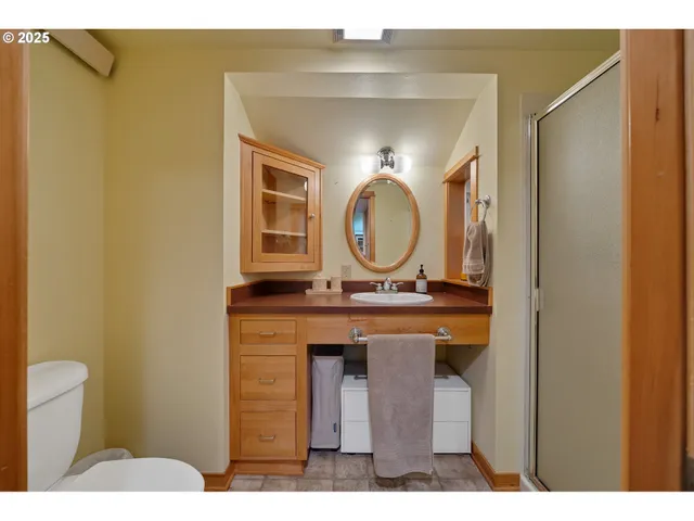 a view of bathroom with a sink and a mirror