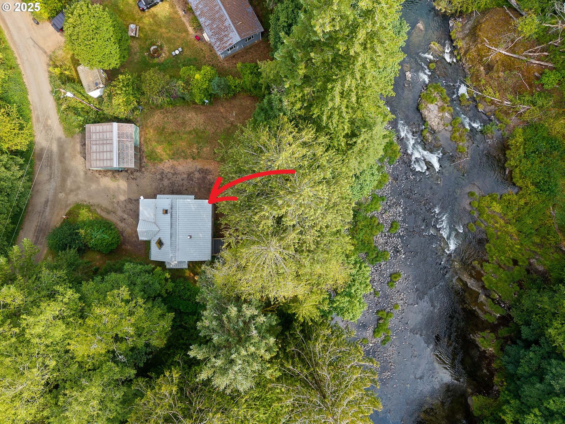 24760 Trask West Tillamook, OR 97141 - Photo 2 of 29 an aerial view of a house with a yard