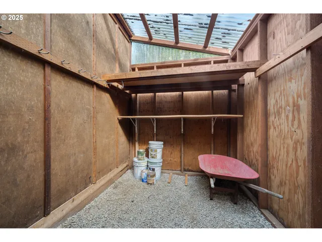a backyard of a house with wooden floor and outdoor seating