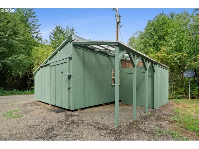 a green field with trees in the background