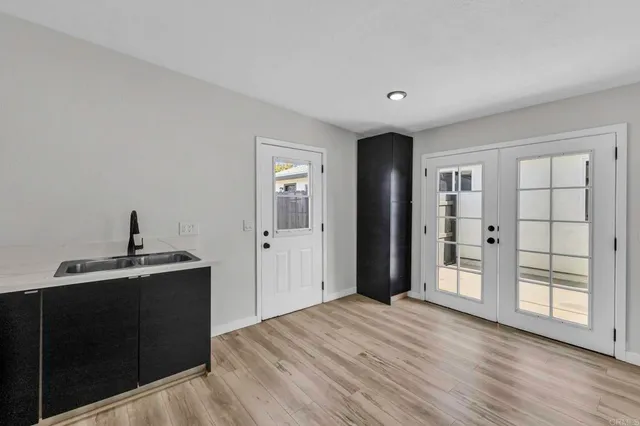 a view of a kitchen with wooden floor