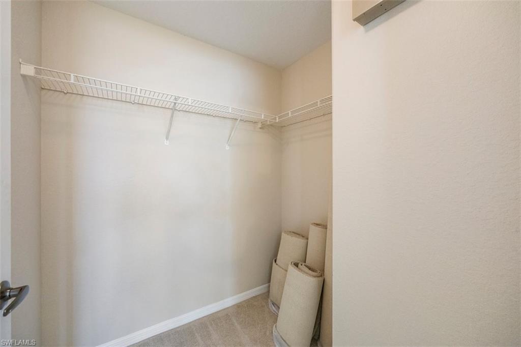 4635 St Croix Lane, Unit 1218 Naples, FL 34109 - Photo 17 of 40 Spacious closet with light carpet