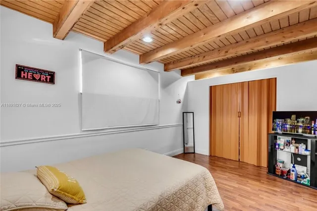 a bedroom with a bed and a book shelf