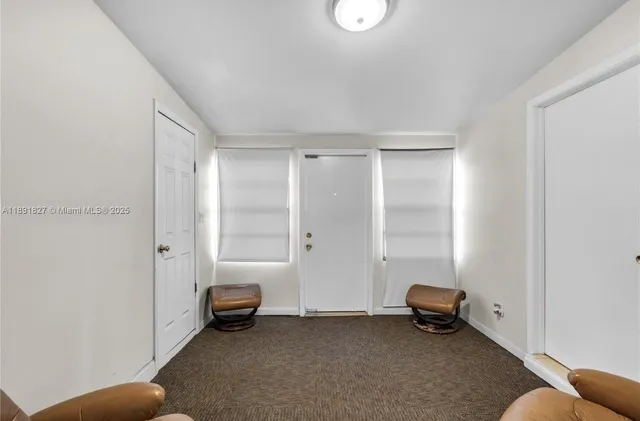 a view of room with furniture and a ceiling fan