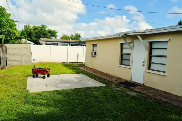 a view of backyard with a table and chair