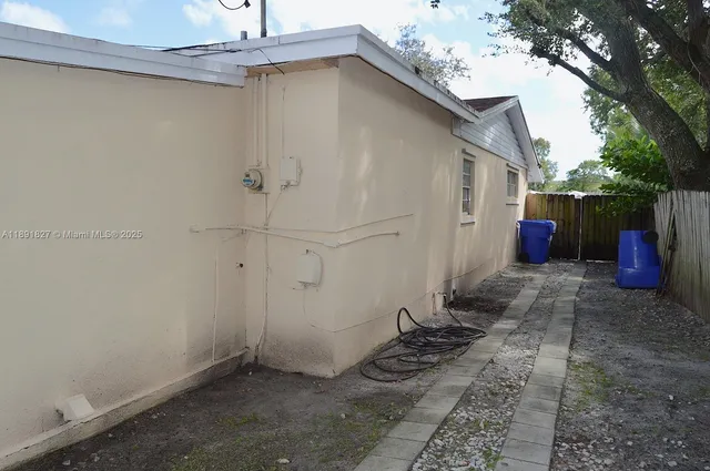 a view of a backyard of the house
