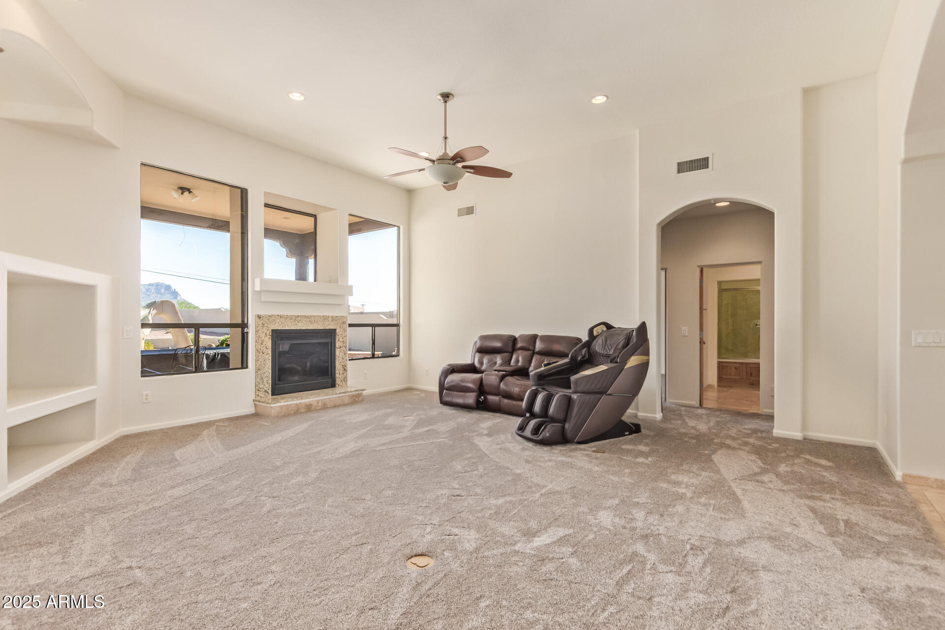 945 North Mountain View Road Apache Junction, AZ 85119 - Photo 11 of 53 a view of a livingroom with furniture and a ceiling fan