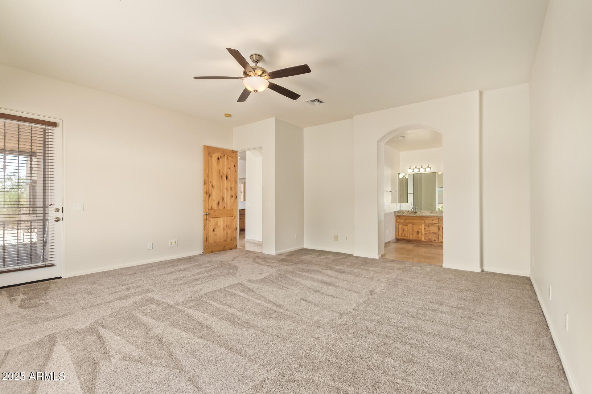 945 North Mountain View Road Apache Junction, AZ 85119 - Photo 20 of 53 an empty room with closet and windows