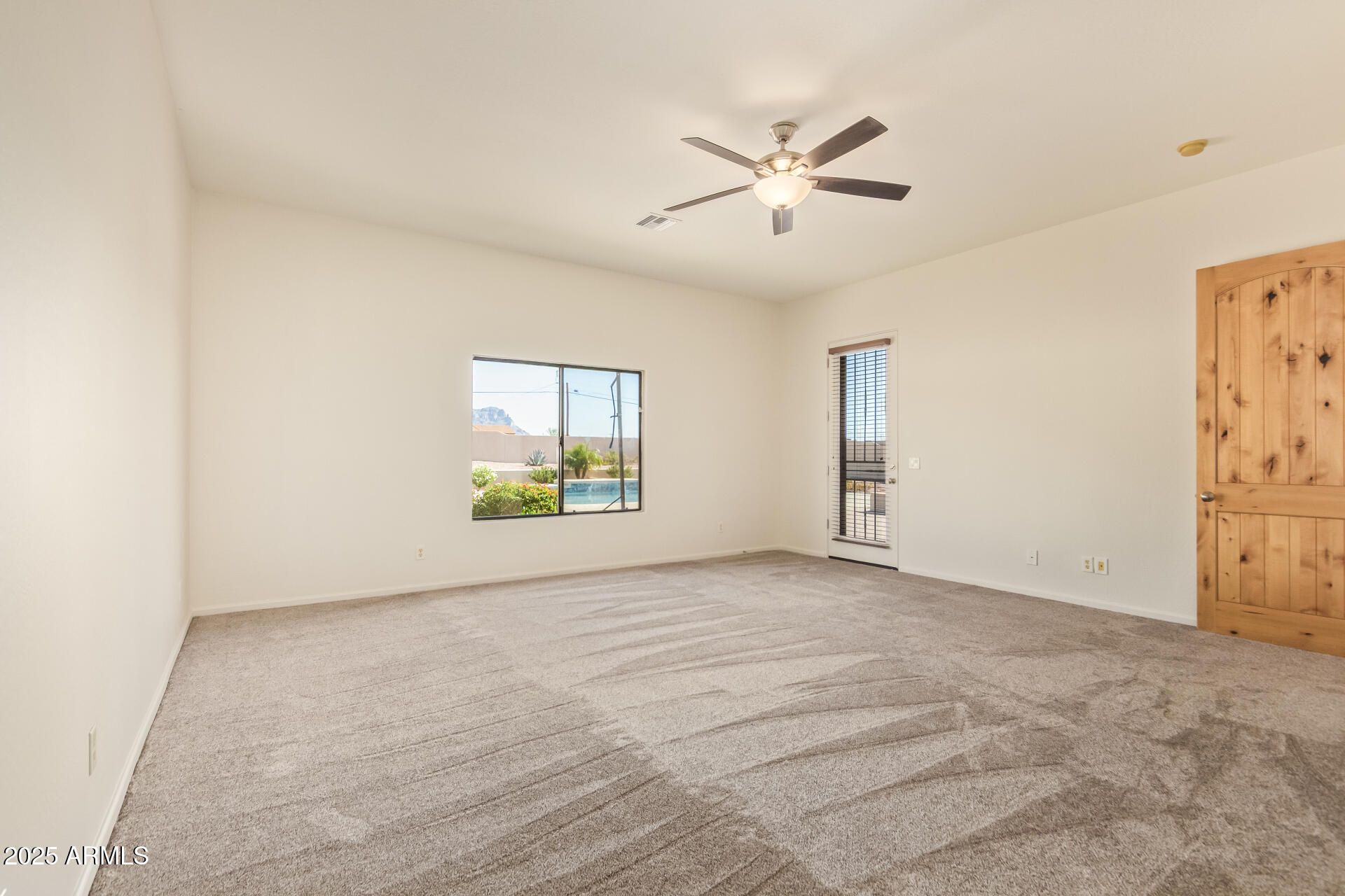 945 North Mountain View Road Apache Junction, AZ 85119 - Photo 21 of 53 a view of an empty room with a window