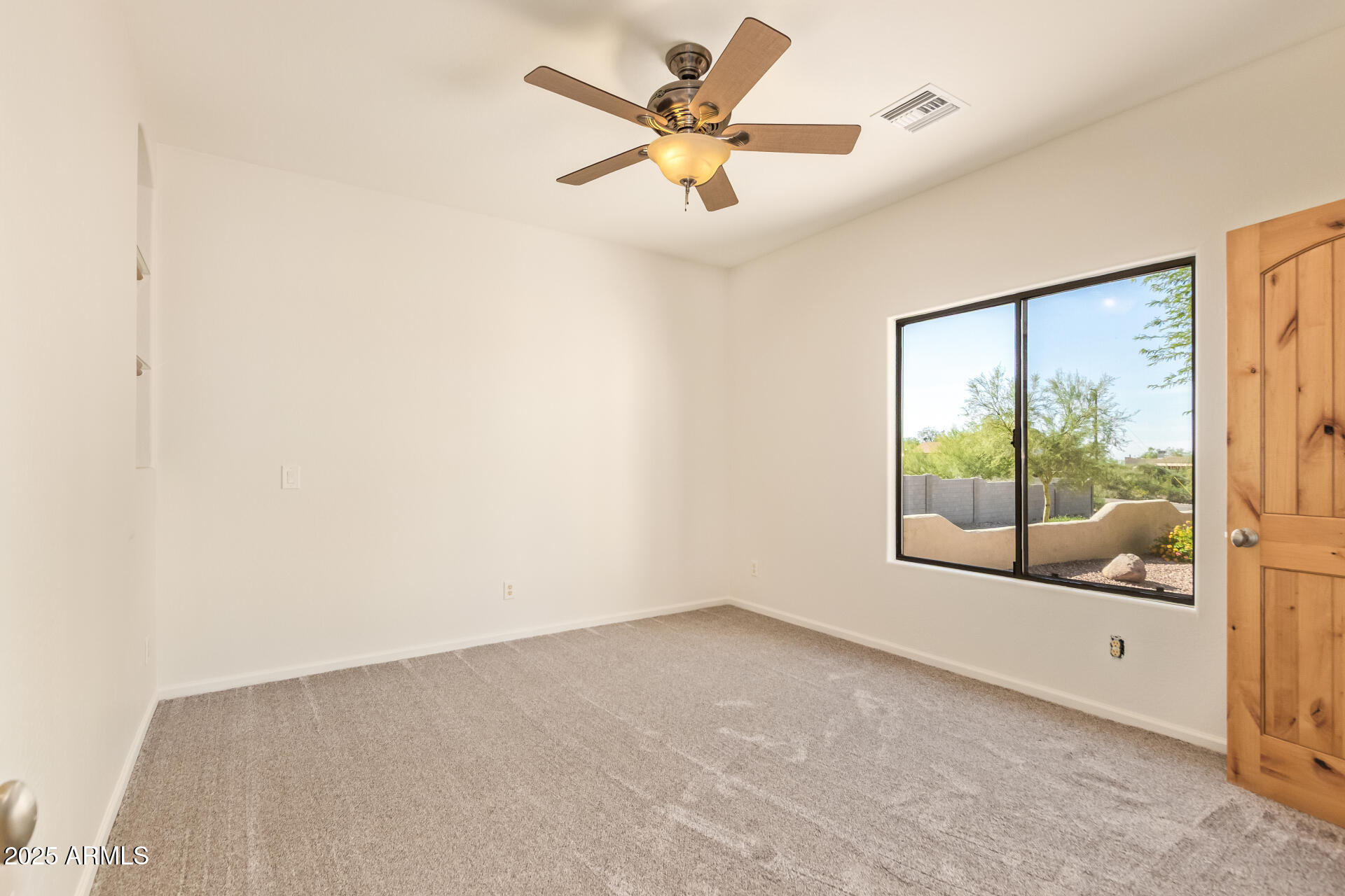945 North Mountain View Road Apache Junction, AZ 85119 - Photo 29 of 53 a view of an empty room with a window