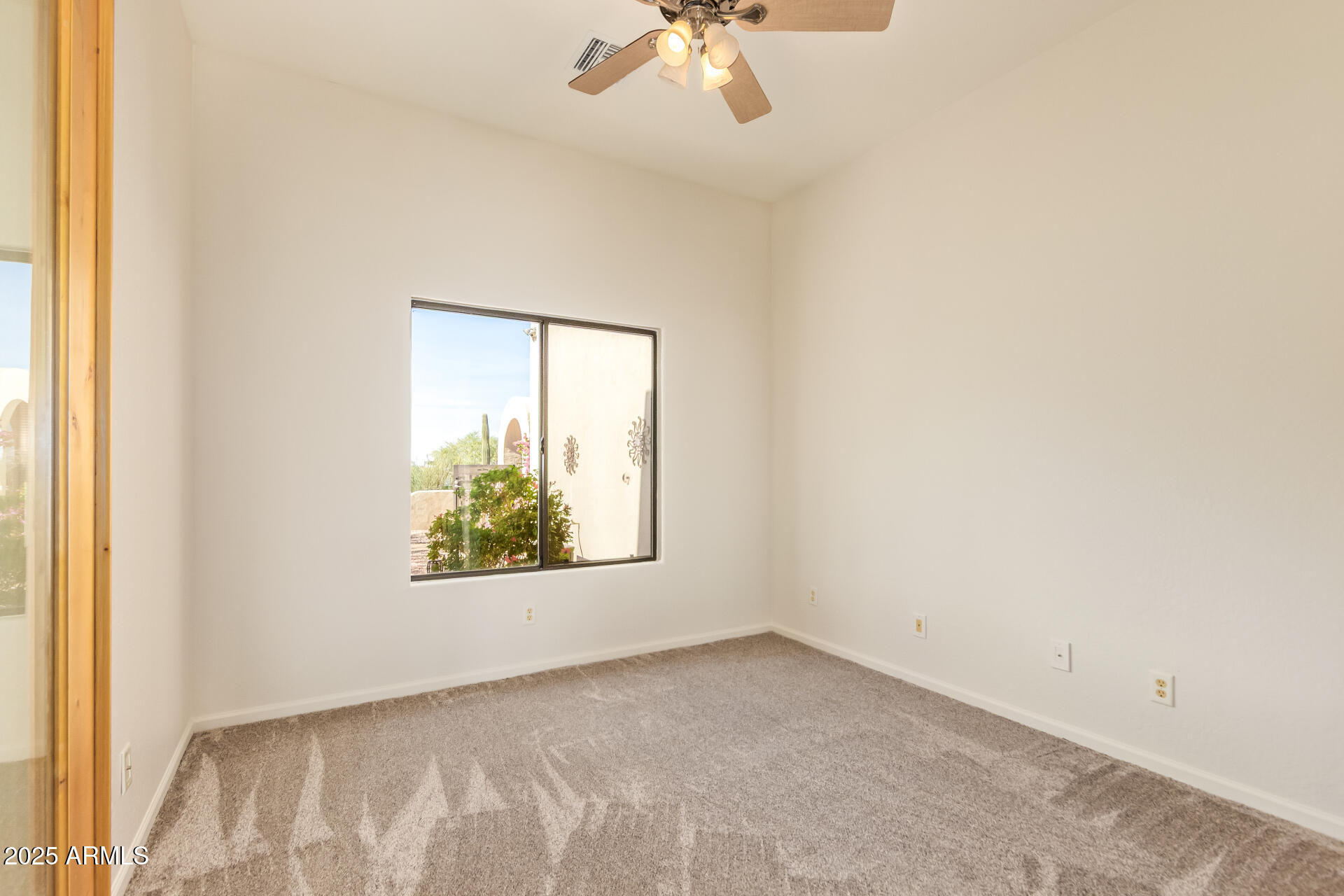945 North Mountain View Road Apache Junction, AZ 85119 - Photo 31 of 53 an empty room with a window