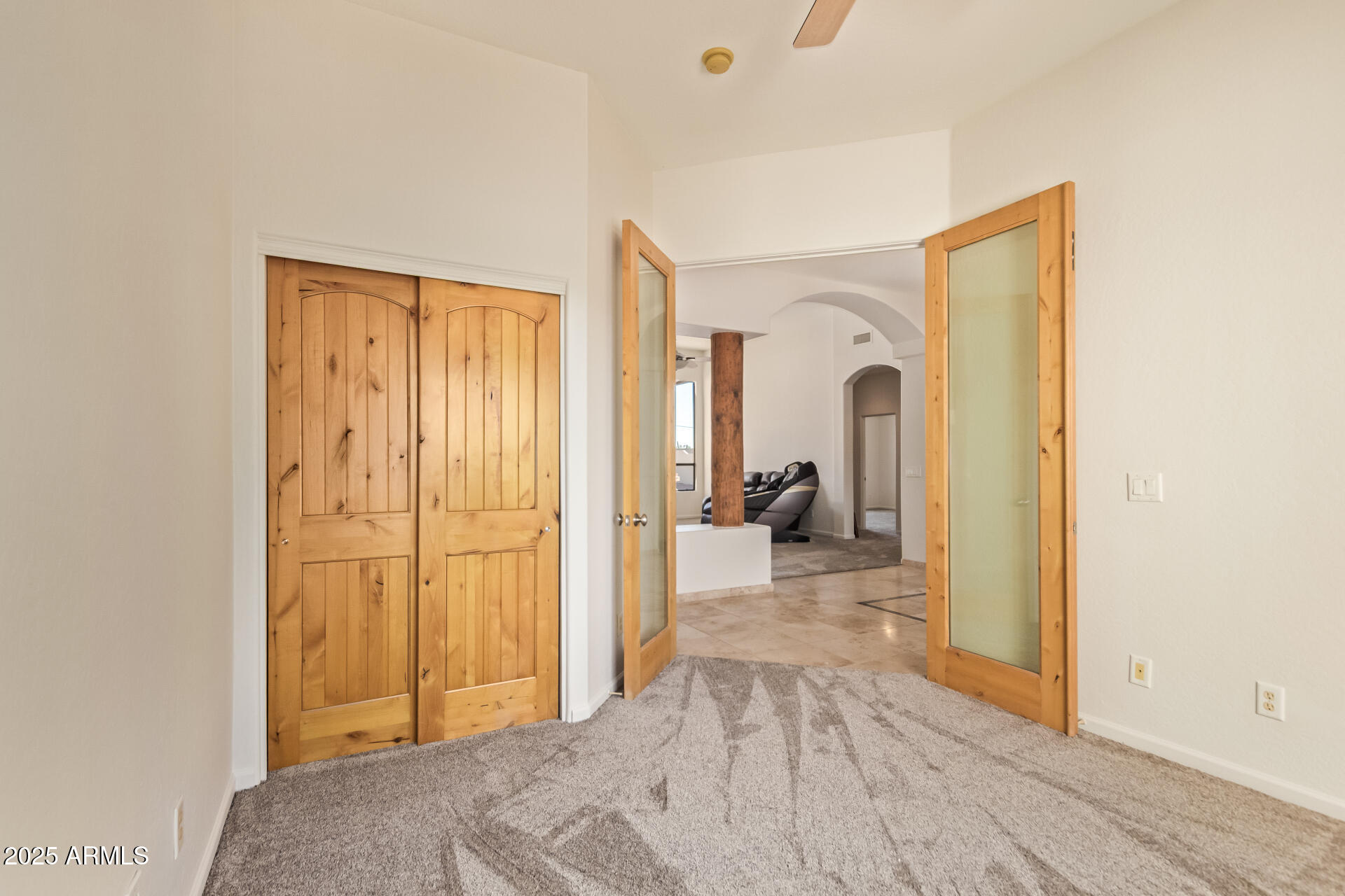 945 North Mountain View Road Apache Junction, AZ 85119 - Photo 32 of 53 a view of a bedroom with a bed and wooden floor