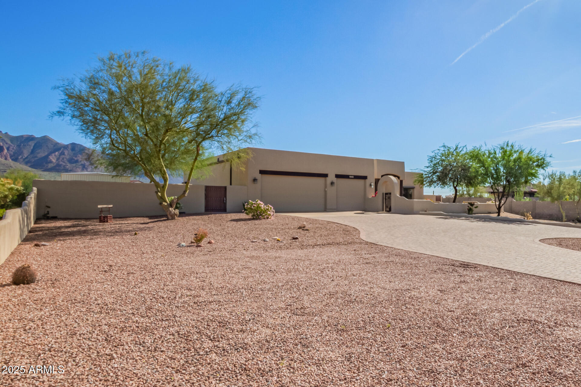 945 North Mountain View Road Apache Junction, AZ 85119 - Photo 4 of 53 a house with trees in front of it