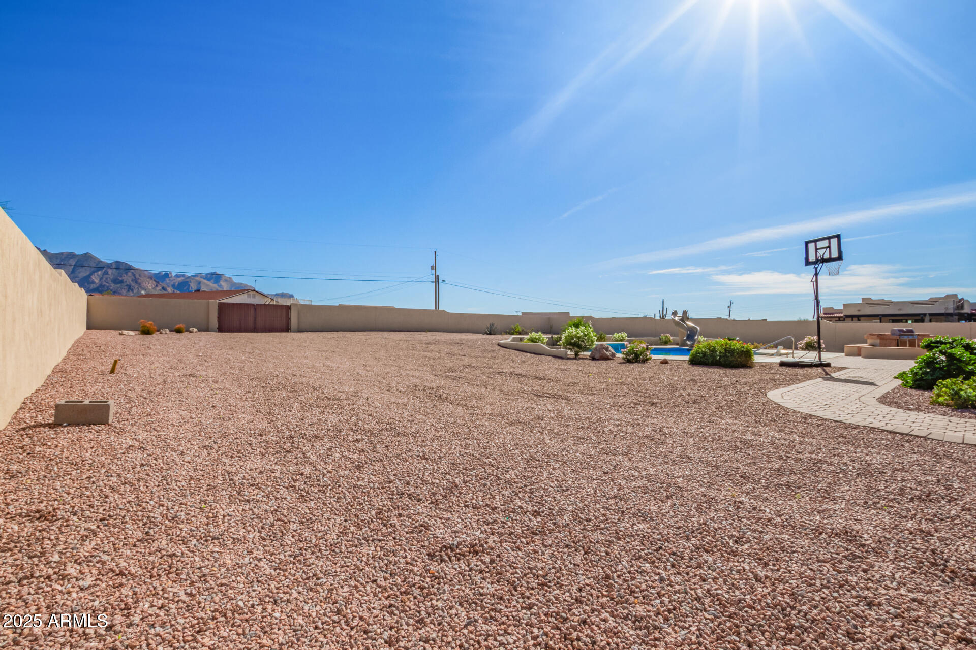 945 North Mountain View Road Apache Junction, AZ 85119 - Photo 41 of 53 a view of a dry yard with wooden fence