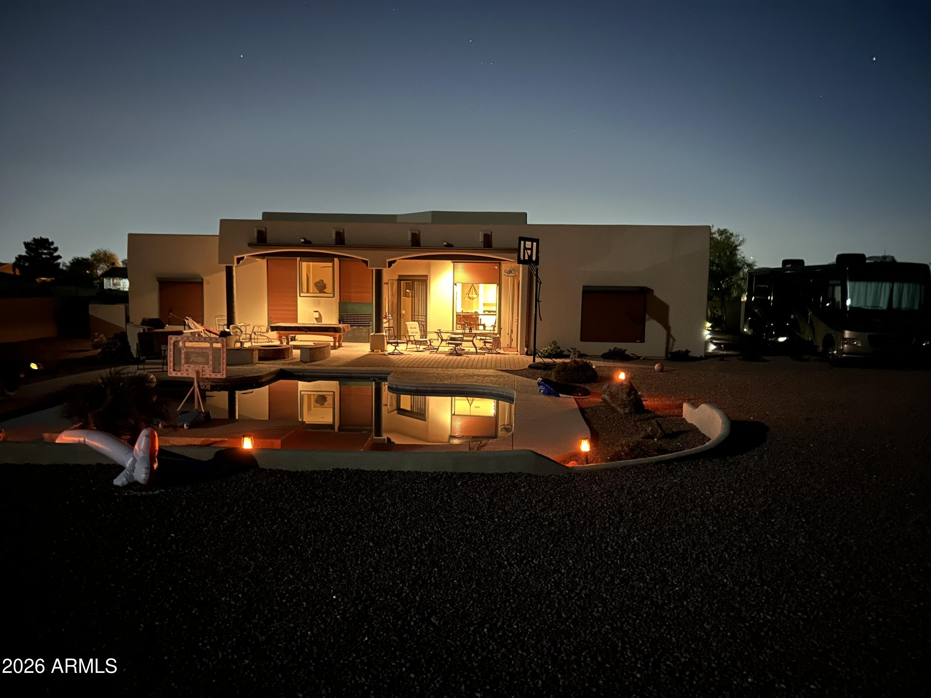 945 North Mountain View Road Apache Junction, AZ 85119 - Photo 48 of 53 a living room with furniture and a flat screen tv