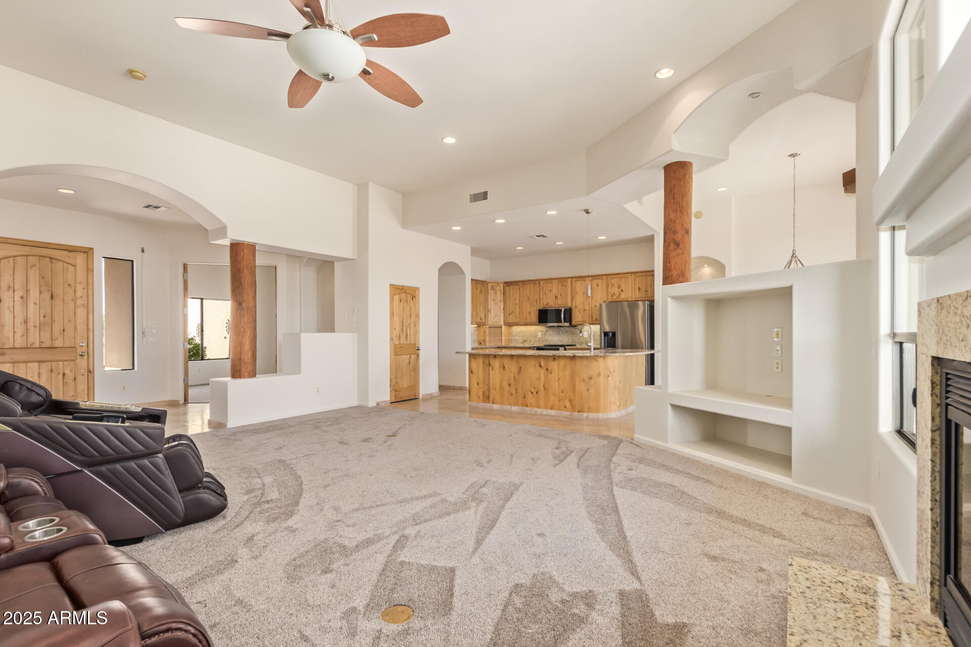945 North Mountain View Road Apache Junction, AZ 85119 - Photo 10 of 53 a view of a livingroom with furniture and a kitchen view