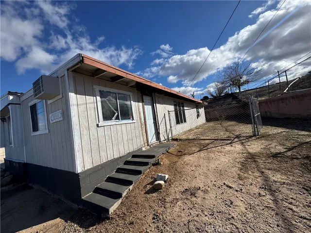 a front view of a house with stairs