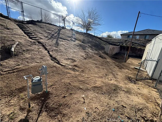 a view of a backyard of a house