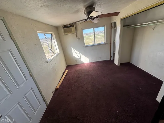 a view of empty room with windows