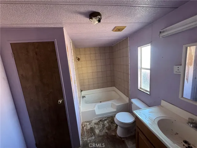 a bathroom with a sink a mirror and a shower
