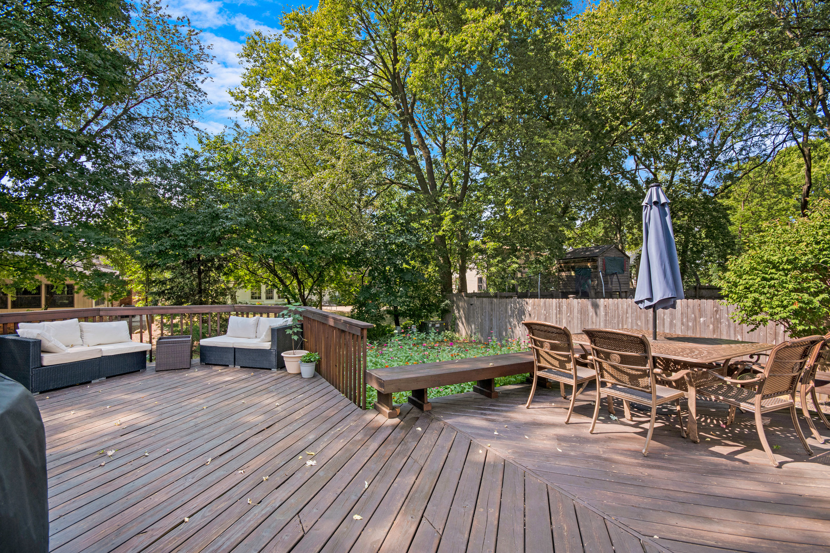 1214 Arthur Road Naperville, IL 60540 - Photo 20 of 21 a view of a patio with table and chairs and wooden floor