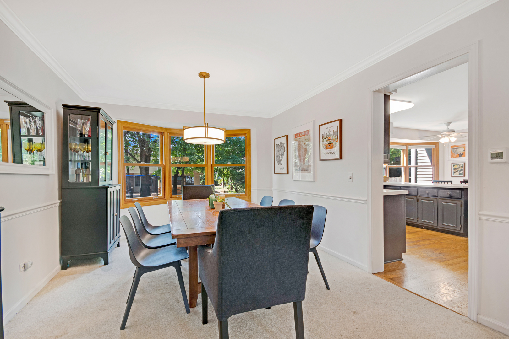 1214 Arthur Road Naperville, IL 60540 - Photo 9 of 21 a dining room with furniture a chandelier and wooden floor
