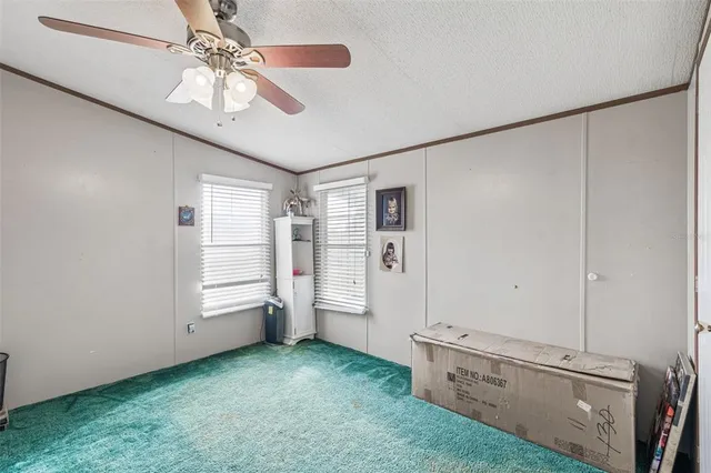 a bathroom with a shower curtain and a toilet