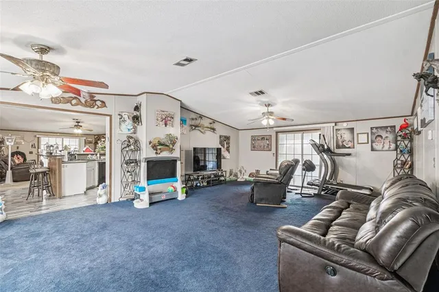 a bedroom with furniture and a flat screen tv