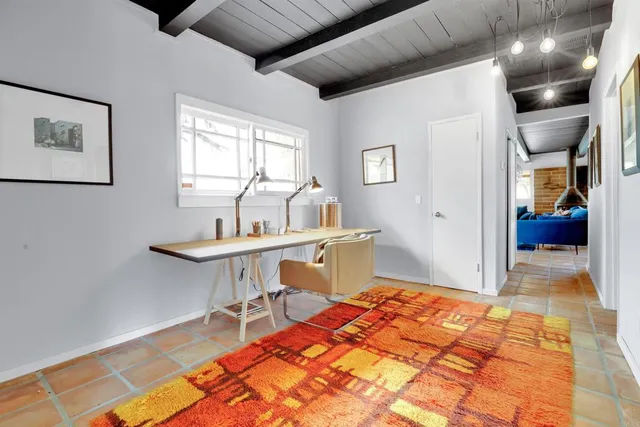 a view of a workspace with furniture