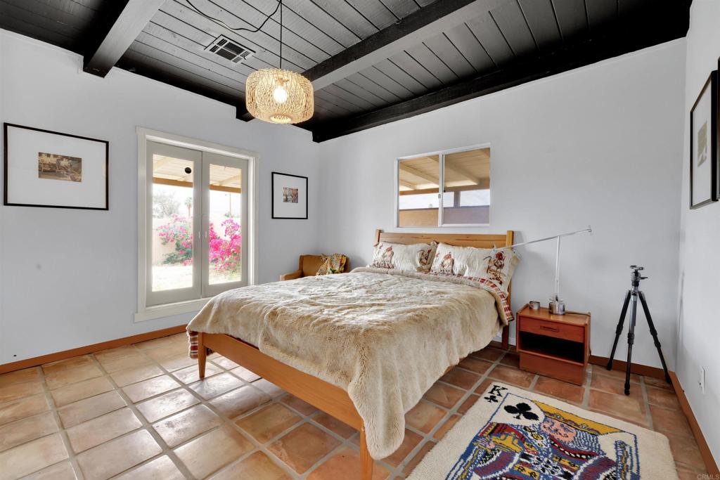 3211 Broken Arrow Road Borrego Springs, CA 92004 - Photo 18 of 46 a bedroom with bed and window