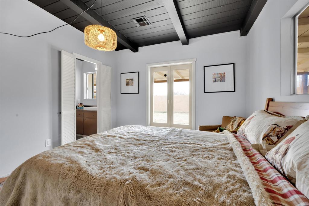 3211 Broken Arrow Road Borrego Springs, CA 92004 - Photo 20 of 46 a bedroom with bed and wooden floor