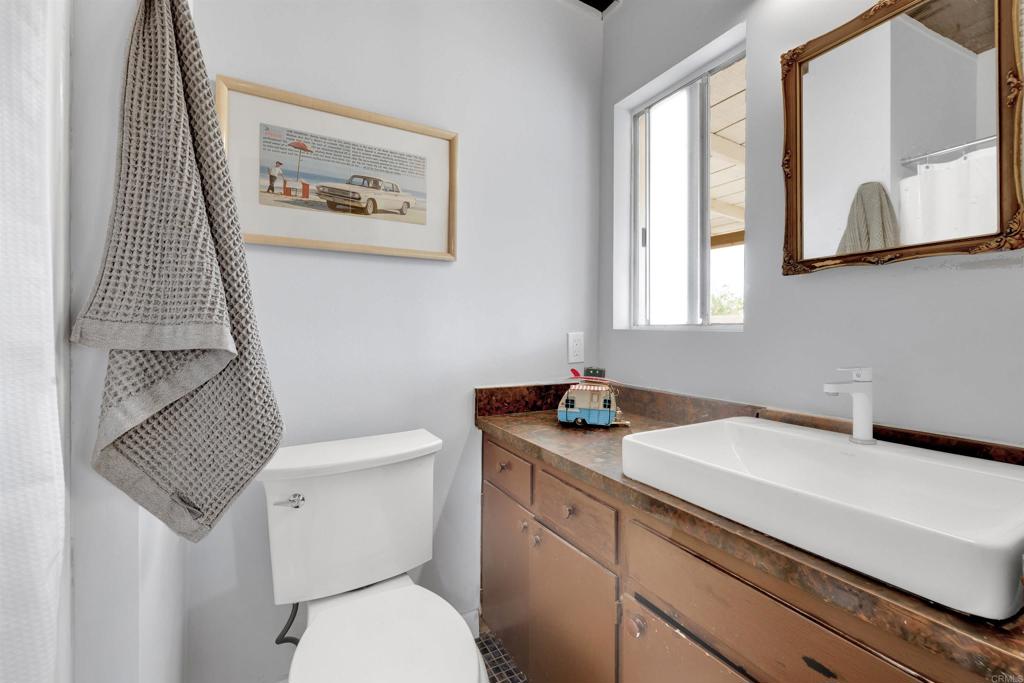 3211 Broken Arrow Road Borrego Springs, CA 92004 - Photo 21 of 46 a bathroom with a toilet sink and mirror