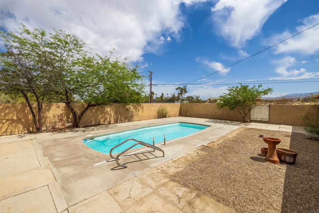 3211 Broken Arrow Road Borrego Springs, CA 92004 - Photo 33 of 46 a view of a swimming pool with an outdoor space and seating area