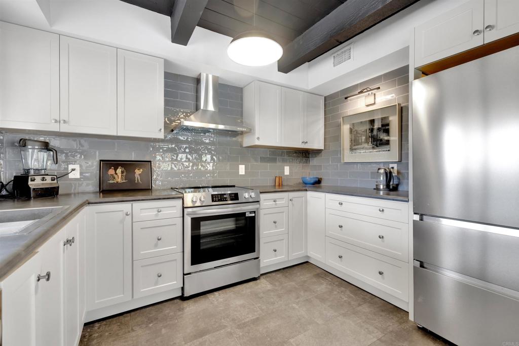 3211 Broken Arrow Road Borrego Springs, CA 92004 - Photo 4 of 46 a kitchen with cabinets stainless steel appliances and sink
