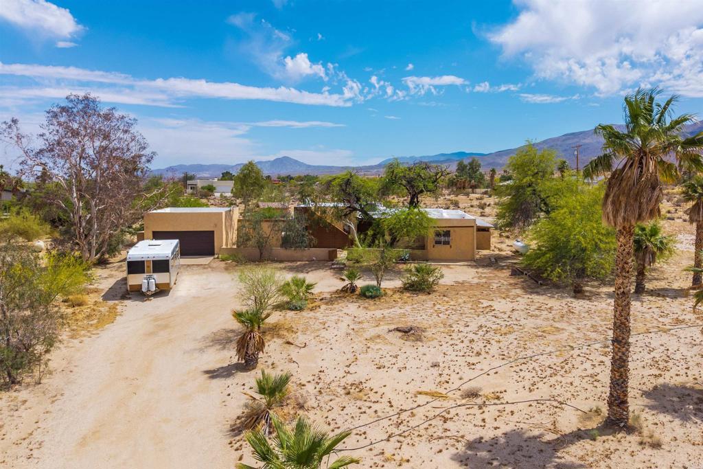 3211 Broken Arrow Road Borrego Springs, CA 92004 - Photo 41 of 46 a view of a backyard with a sitting area