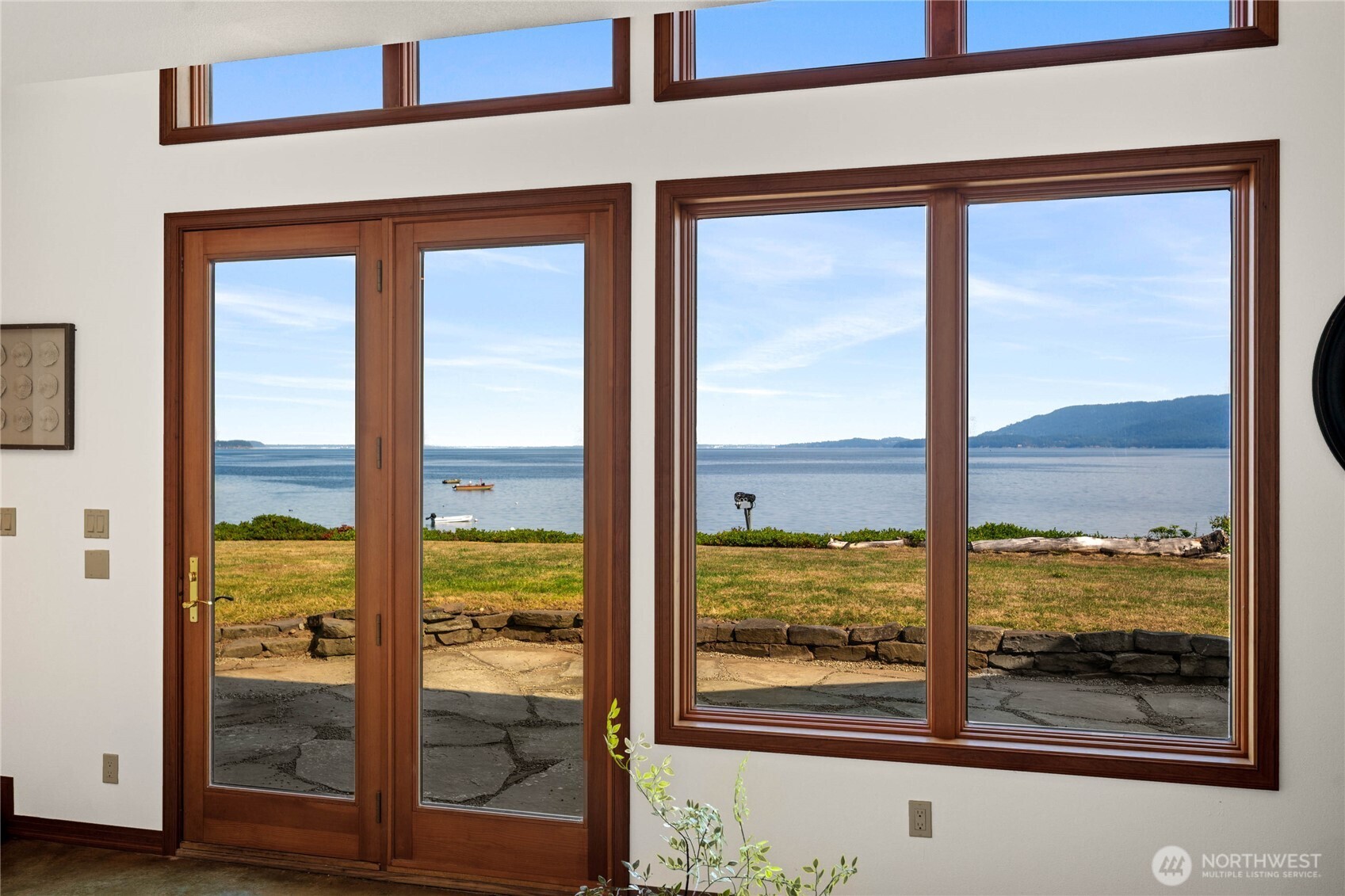 9551 Samish Island Road Bow, WA 98232 - Photo 16 of 40 a view of a glass door and a window