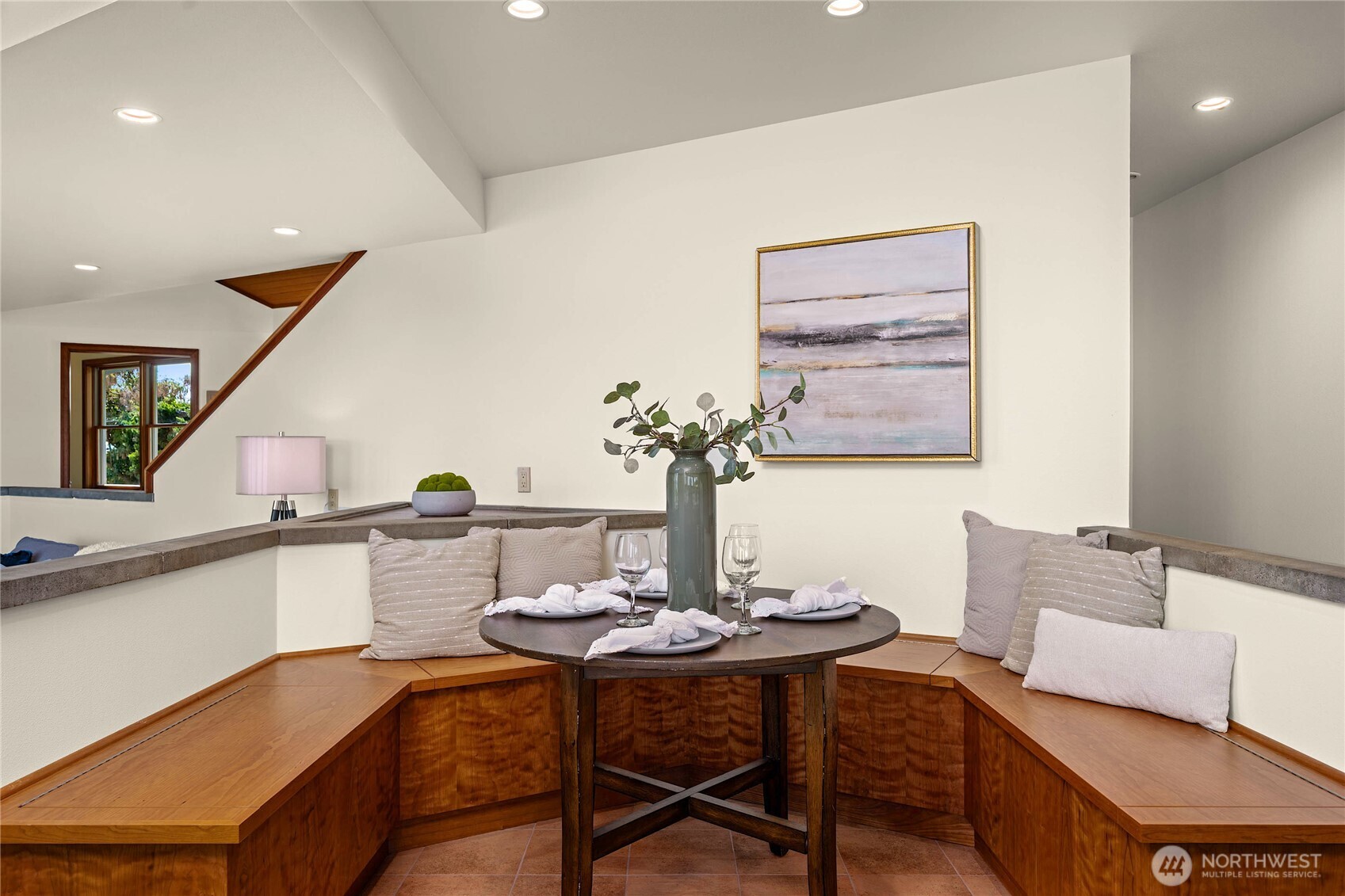 9551 Samish Island Road Bow, WA 98232 - Photo 19 of 40 a view of a dining room with furniture and wooden floor