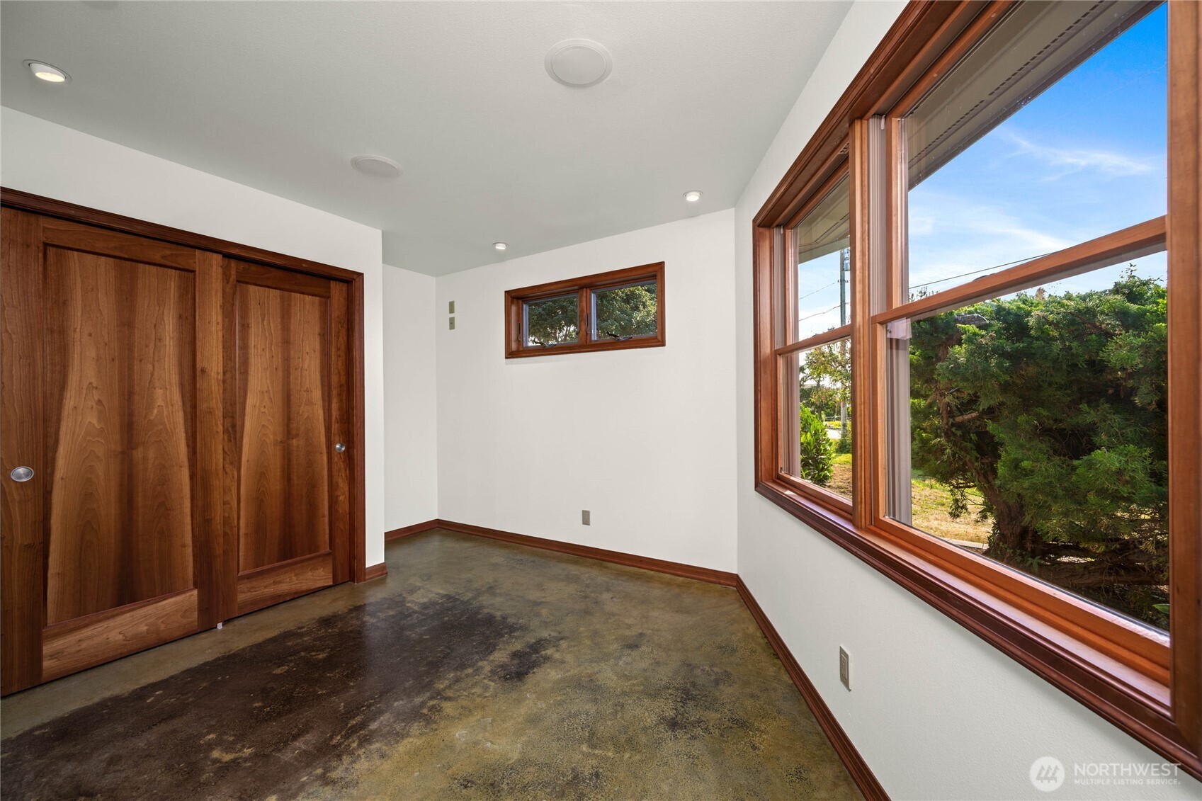 9551 Samish Island Road Bow, WA 98232 - Photo 23 of 40 wooden floor in an empty room with a window
