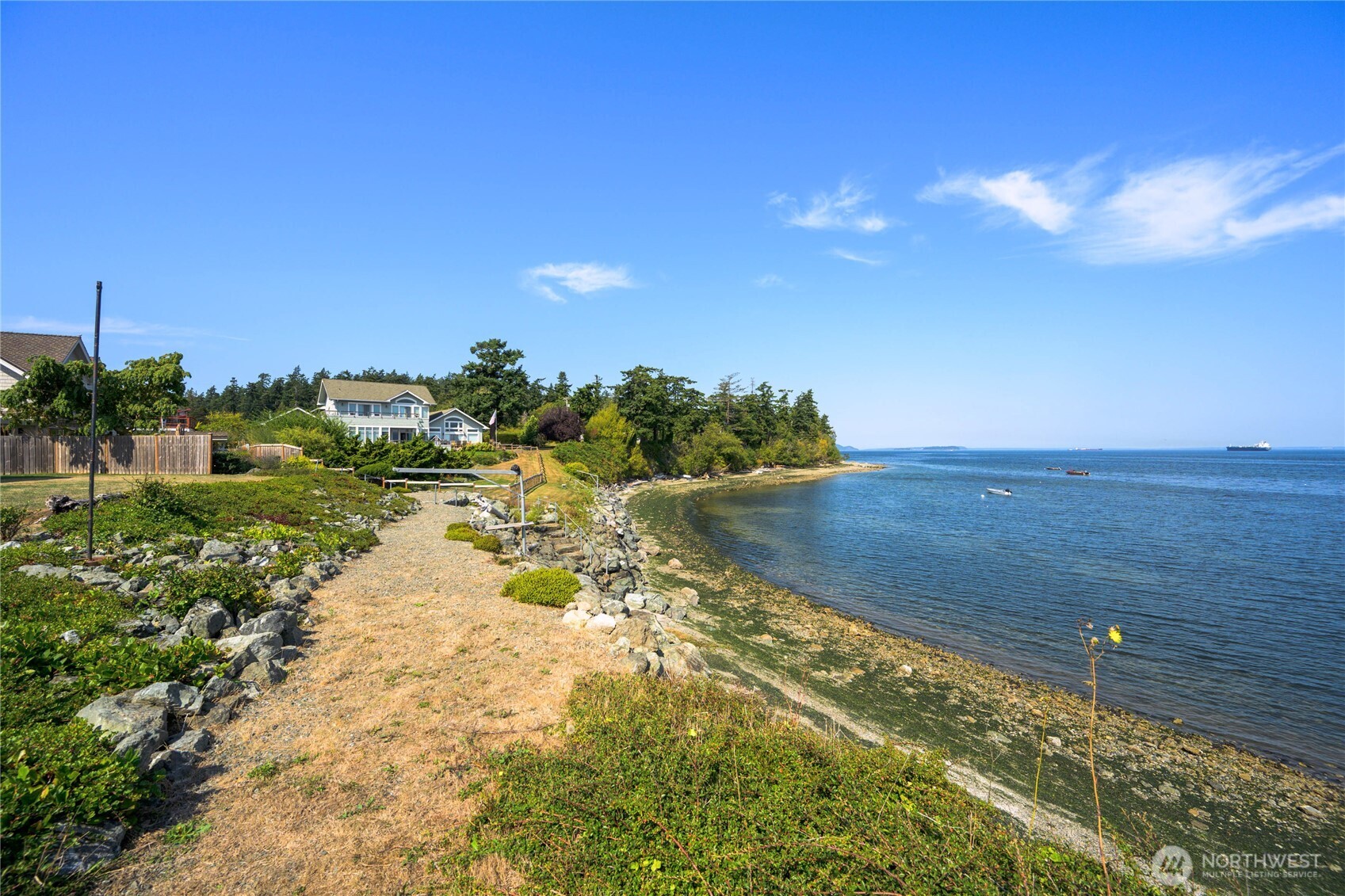 9551 Samish Island Road Bow, WA 98232 - Photo 35 of 40 a view of a lake with a yard