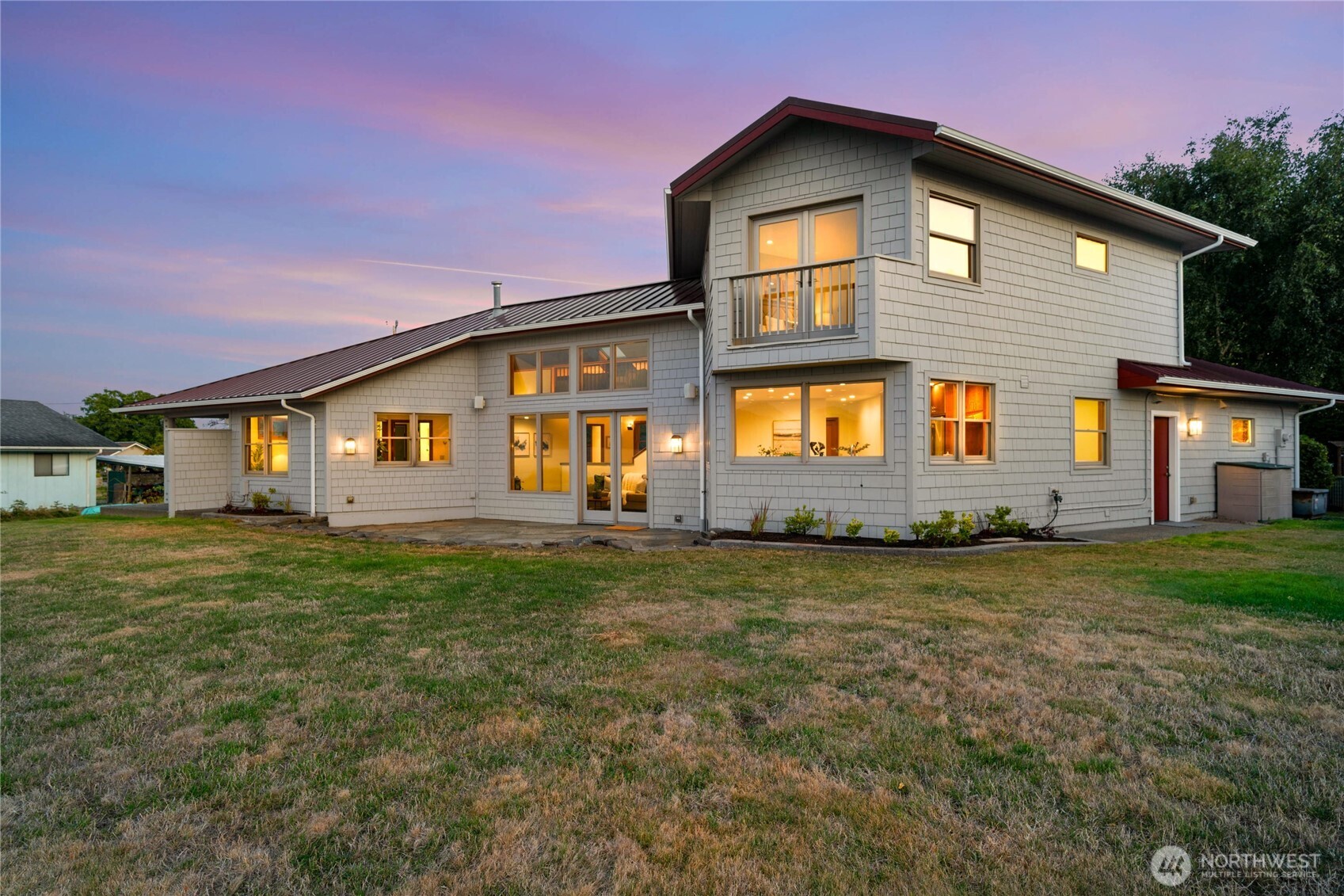 9551 Samish Island Road Bow, WA 98232 - Photo 8 of 40 a front view of a house with a garden