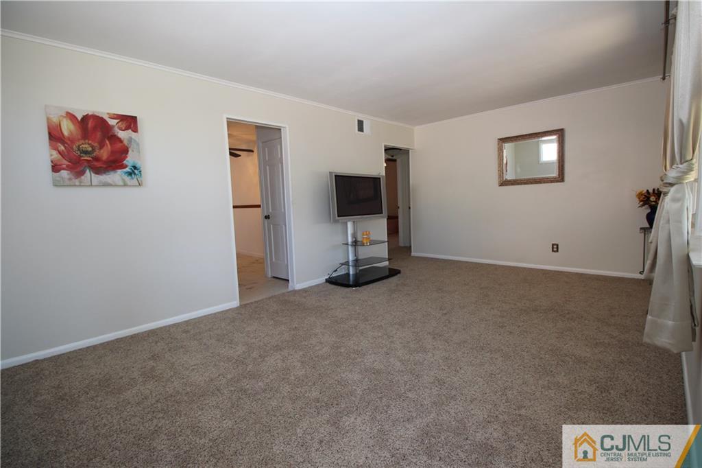 24 Gilmore Road Ewing, NJ 08628 - Photo 2 of 22 a view of an empty room with a window