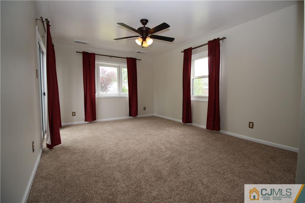 24 Gilmore Road Ewing, NJ 08628 - Photo 12 of 22 a view of a livingroom with a ceiling fan and window