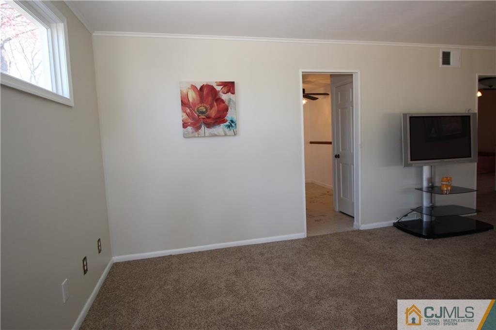 24 Gilmore Road Ewing, NJ 08628 - Photo 3 of 22 a view of a livingroom with a flat screen tv