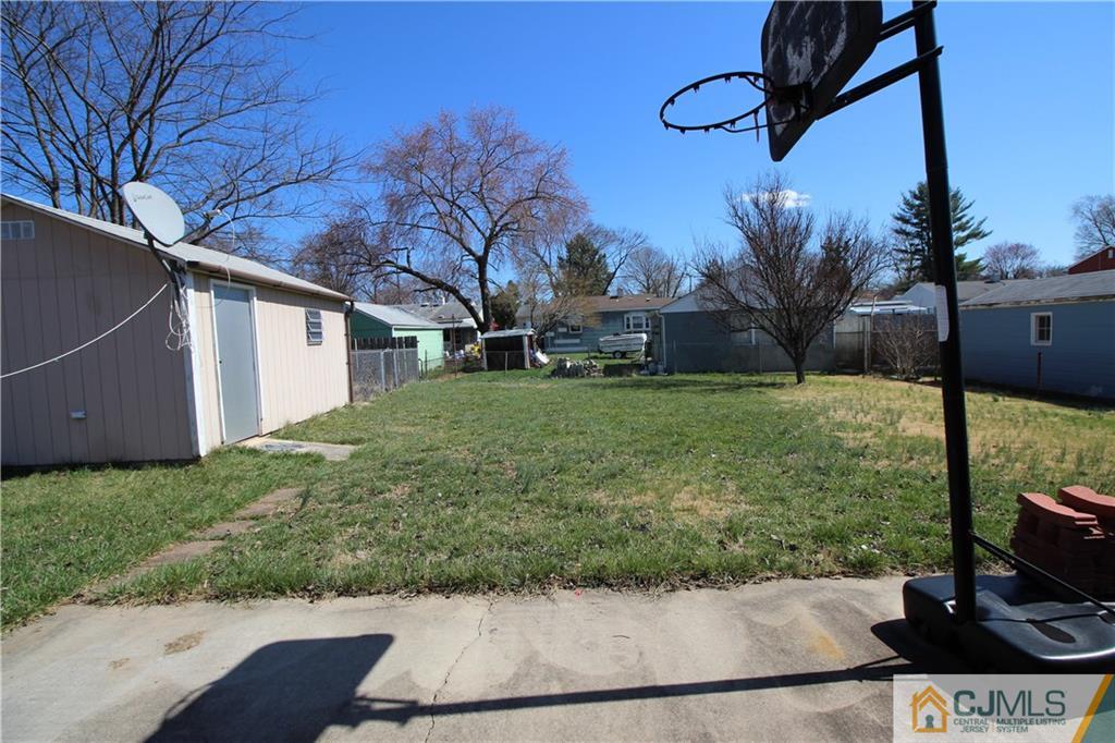 24 Gilmore Road Ewing, NJ 08628 - Photo 22 of 22 a view of a yard with potted plants
